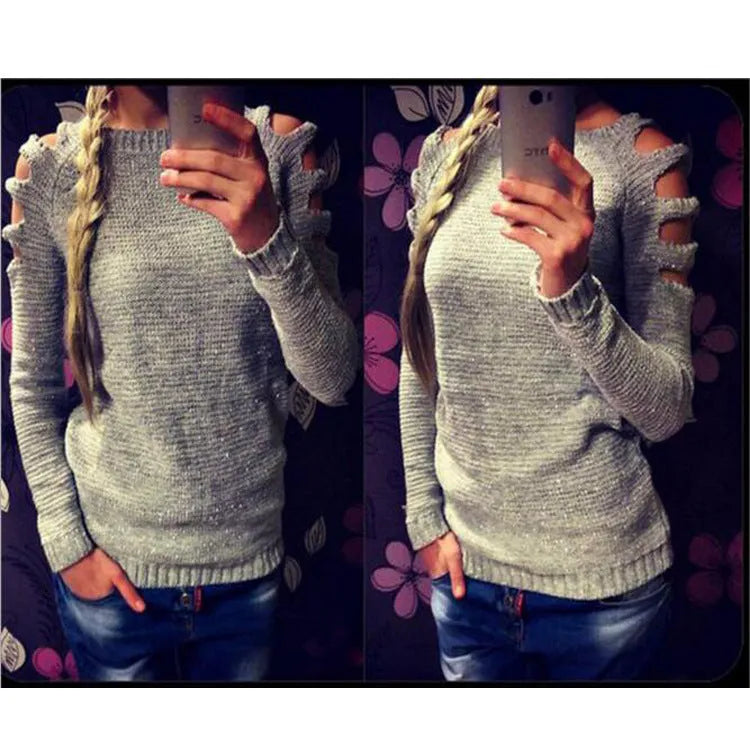 Women's white hollow-out crocheted knit shirt with round neck and long sleeves laid flat.