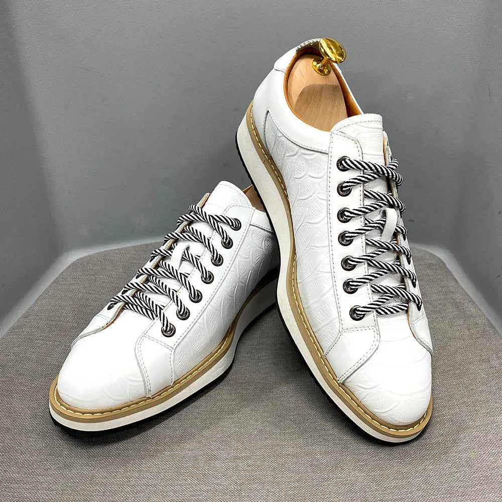 Men's white low-top casual shoes with a patterned embossed upper and front lace closure.