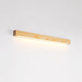 Walnut colour wood and acrylic strip wall lamp in three lengths on a white wall.