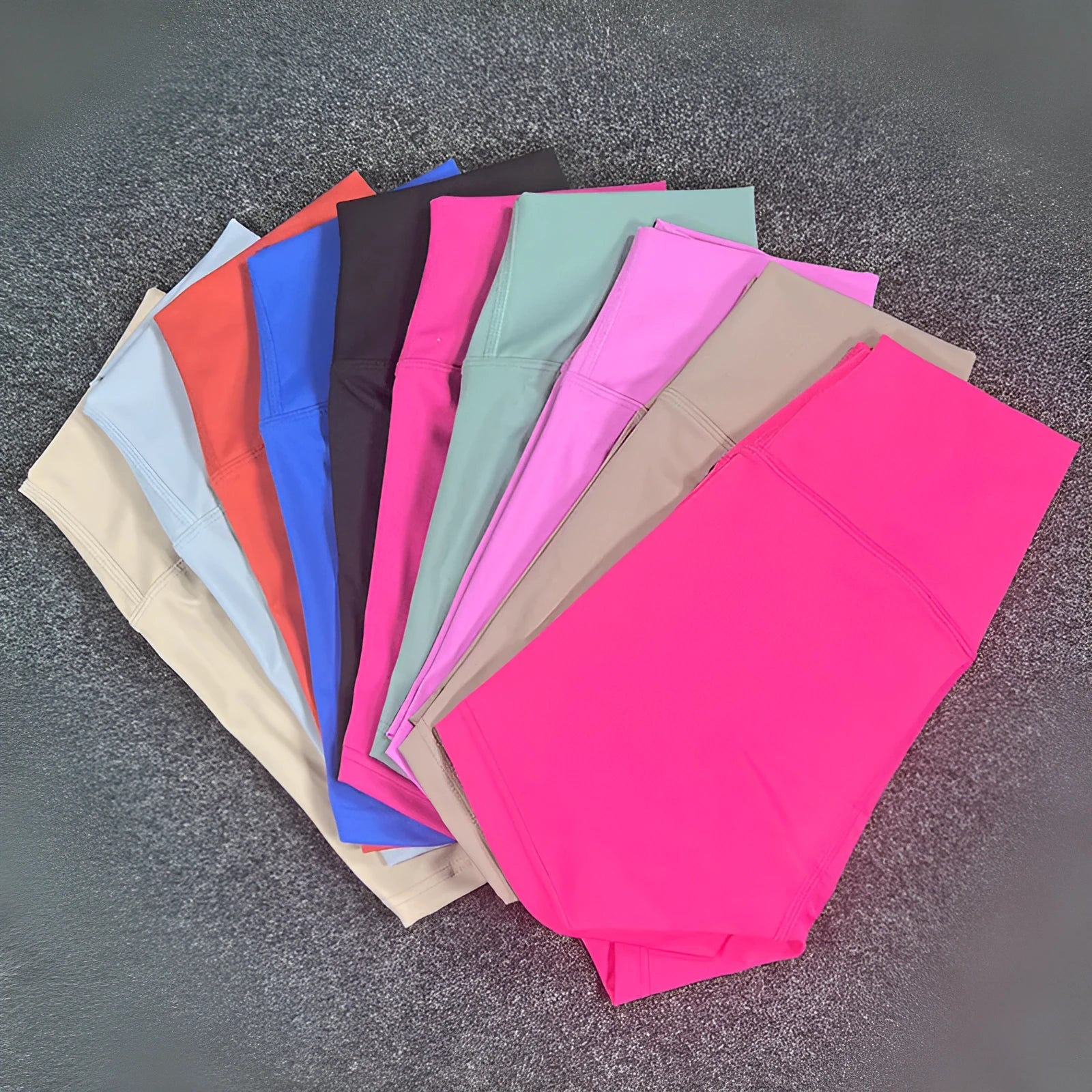 Women's high waist yoga shorts in nylon fabric, shown in multiple colours including pink litchi and electric blue.