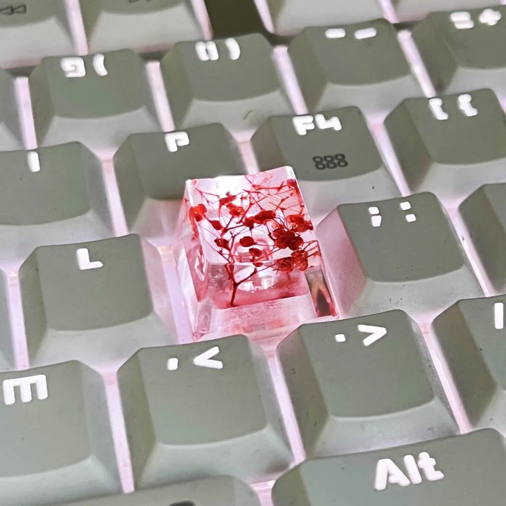 Transparent resin starry sky keycap for mechanical keyboards in green, measuring 1.8cm by 1.2cm.