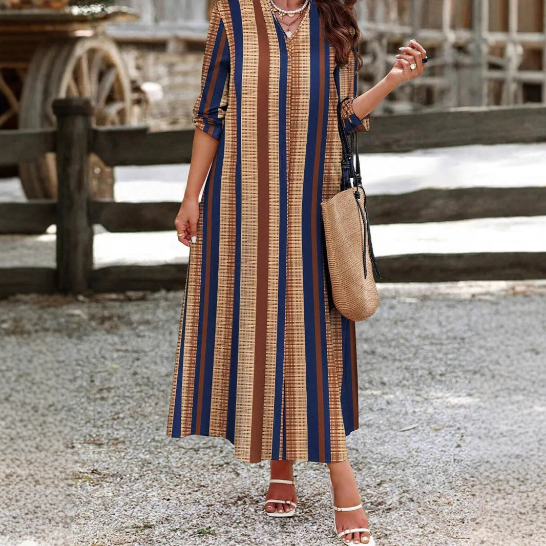 Women's camel coloured knitted A-line dress with vertical stripes and V-neck design