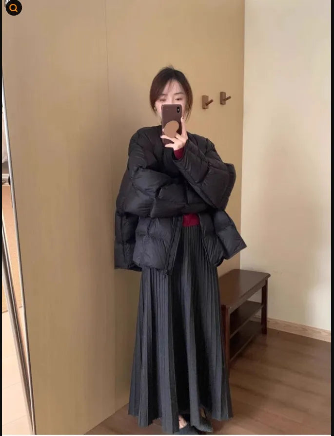 Dark grey knitted long dress suit with 3D pattern and collage stitching, shown with matching skirt.