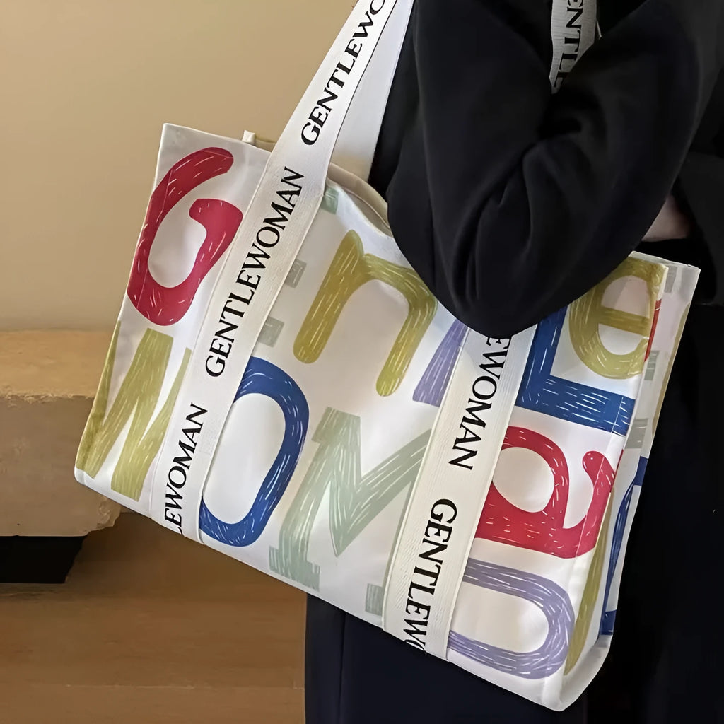 Large canvas women's tote bag with printing, shown in different colour and pattern style options.