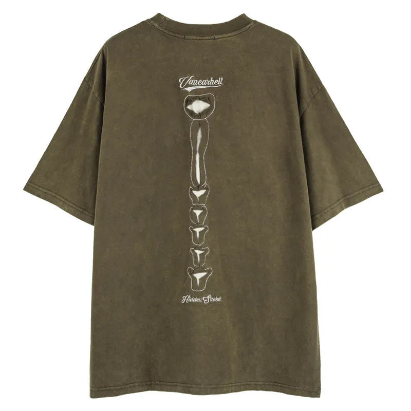 Brown cotton t-shirt with a large black skull graphic print and drop-shoulder sleeves.