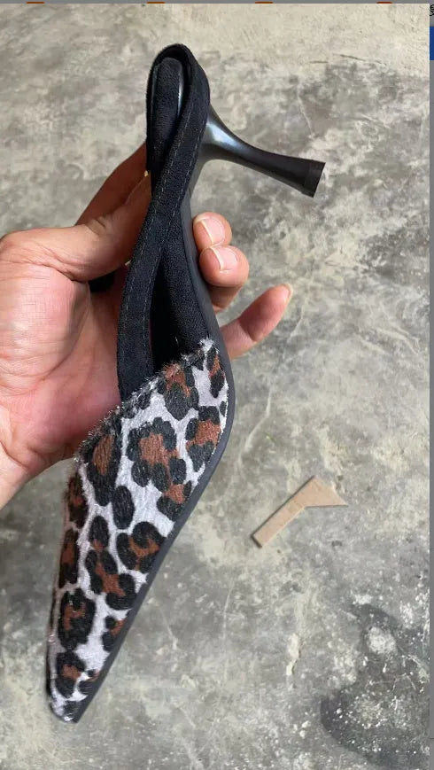 Leopard print suede women's pointed toe open sandals on a white background.