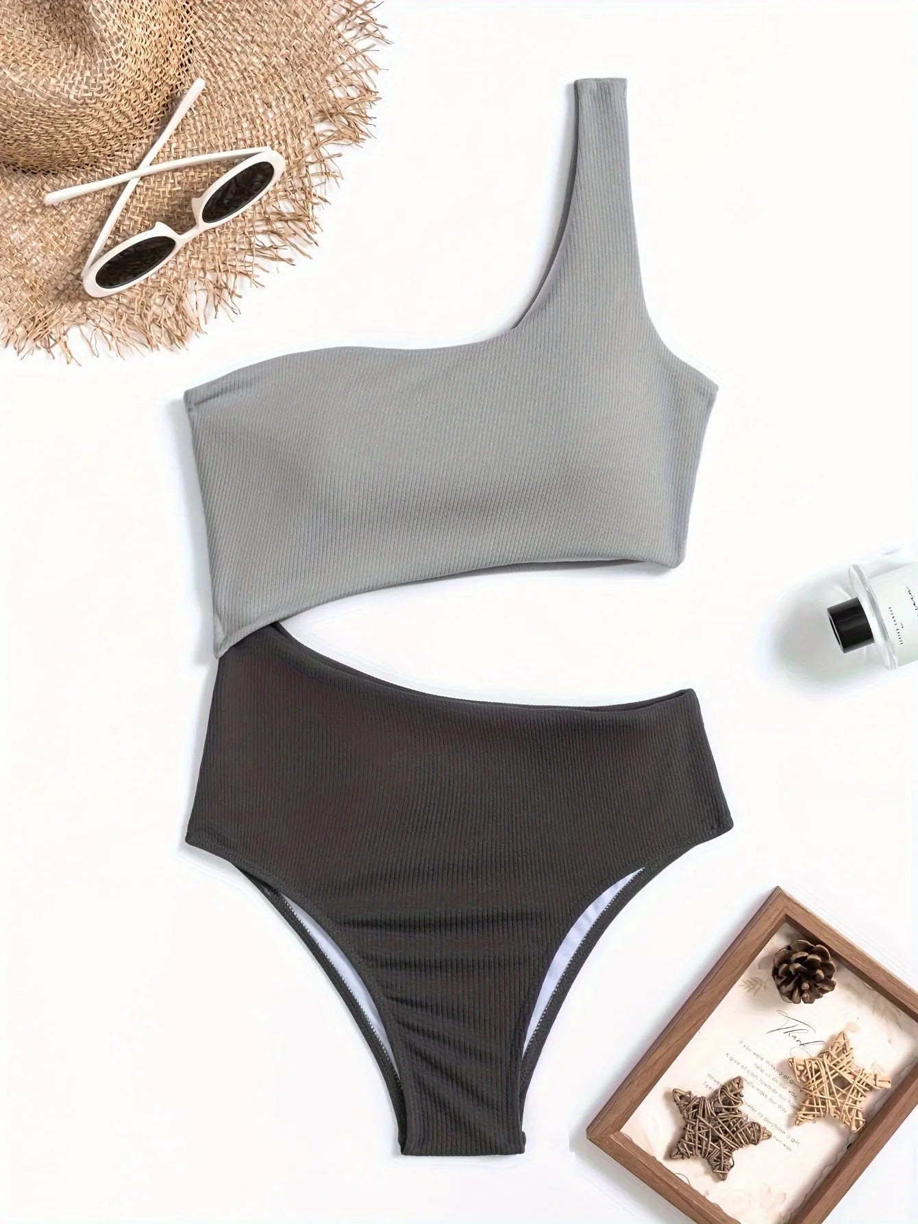 Women's light grey one-shoulder one-piece swimsuit on mannequin