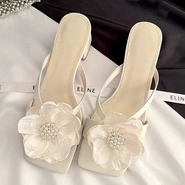 Women's cream white sandals with chunky heel, square toe, and a single satin strap.