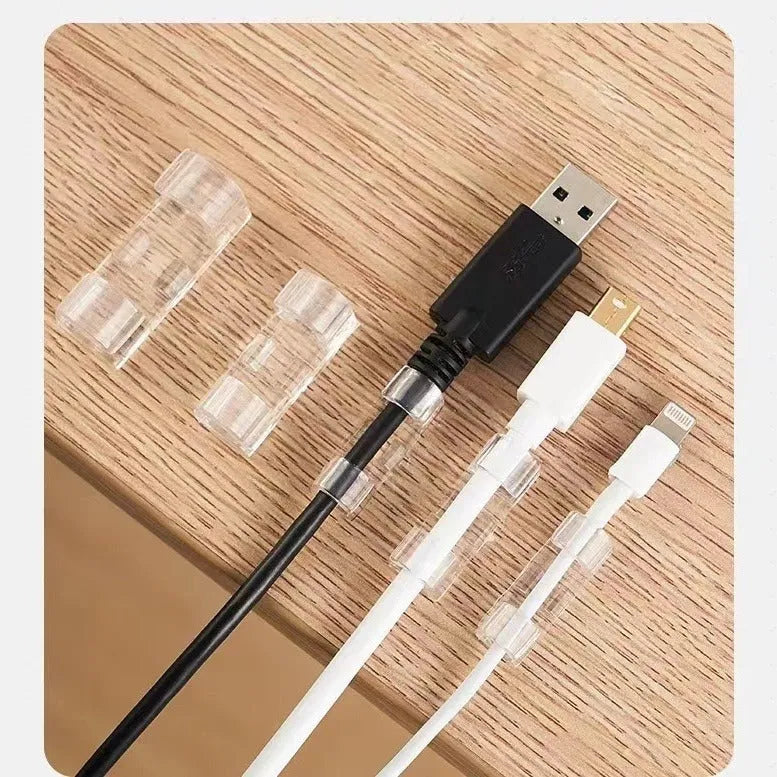 Transparent self-adhesive plastic cable clips in small, medium, large, and extra large sizes for wire management.