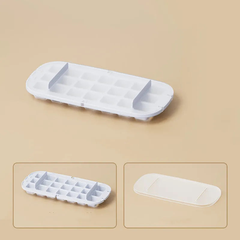 High capacity blue ice cube tray with ice grid and attached storage for the included shovel.