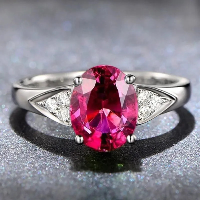 Women's court style ring with a natural zircon inlay, showing pattern options of heart, water drop, and bell.