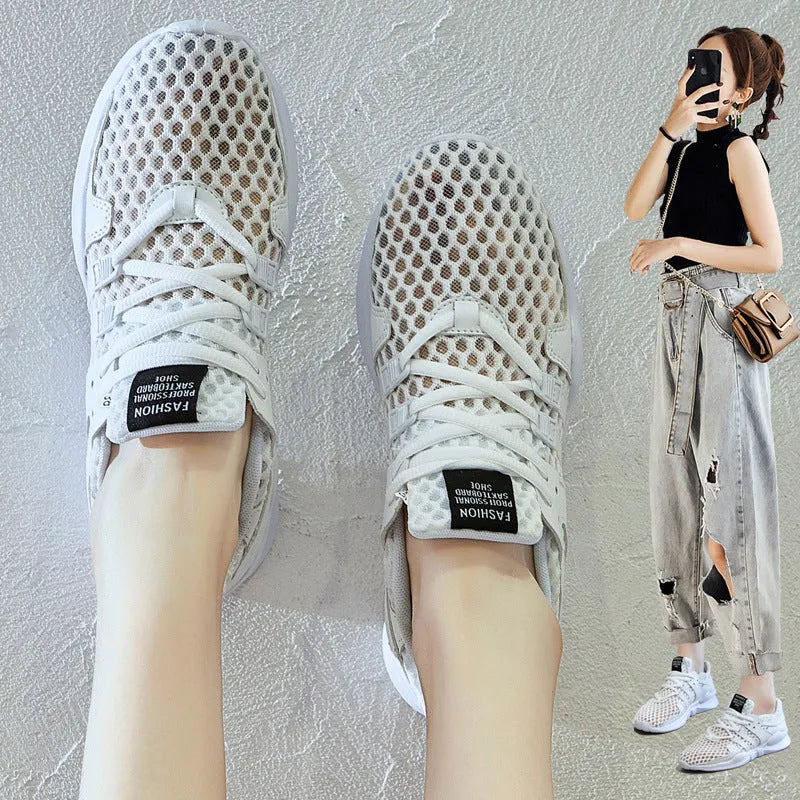 Breathable hollow mesh sneakers in black and white colours with round toe design