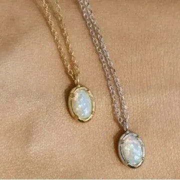 Oval geometric pendant necklace with jelly opal stone in silver plating, shown in golden and white gold colour options.