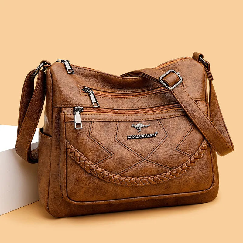 Soft PU leather women's crossbody shoulder bag in horizontal square shape with internal zipper compartments