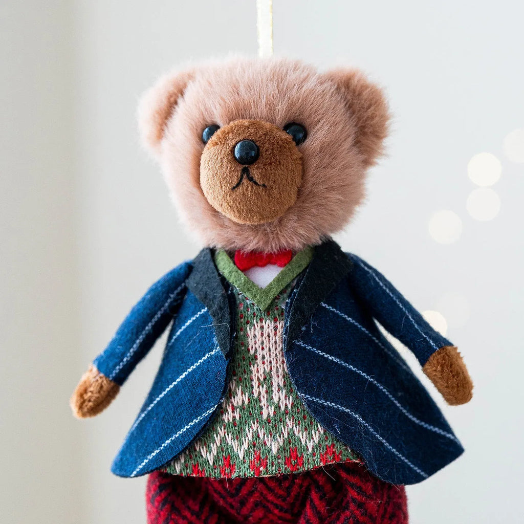 Cartoon plush bear couple, one in a gentleman's suit and one in a princess's plaid dress
