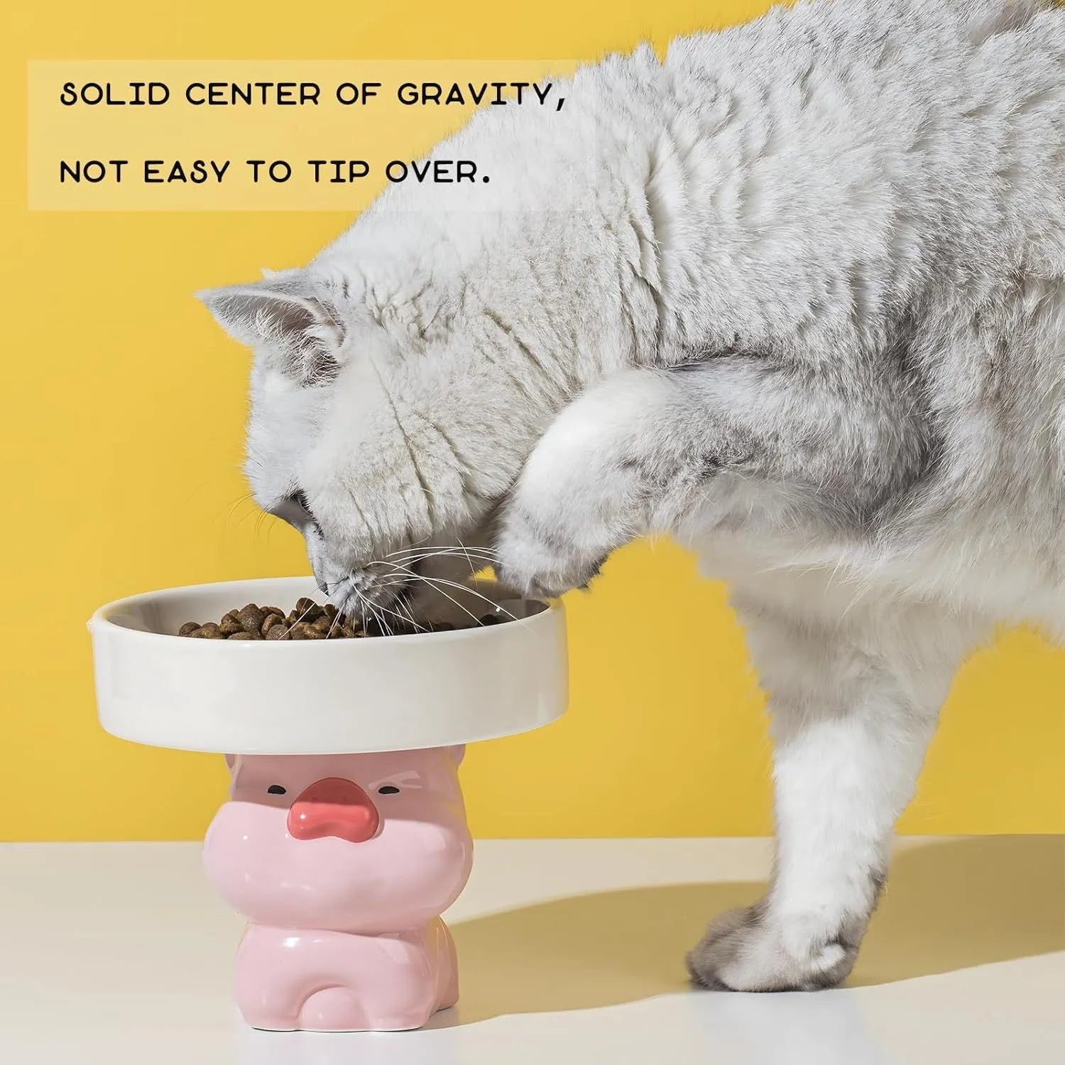 Ceramic elevated cat food bowl with animal theme design in pink, yellow, or white