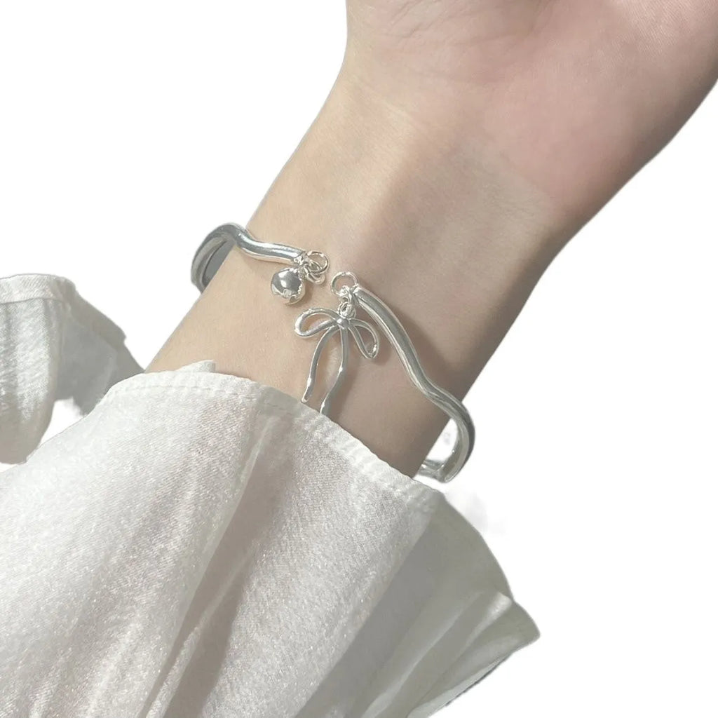 Silver bow adjustable bracelet with bell opening clasp on zinc alloy chain