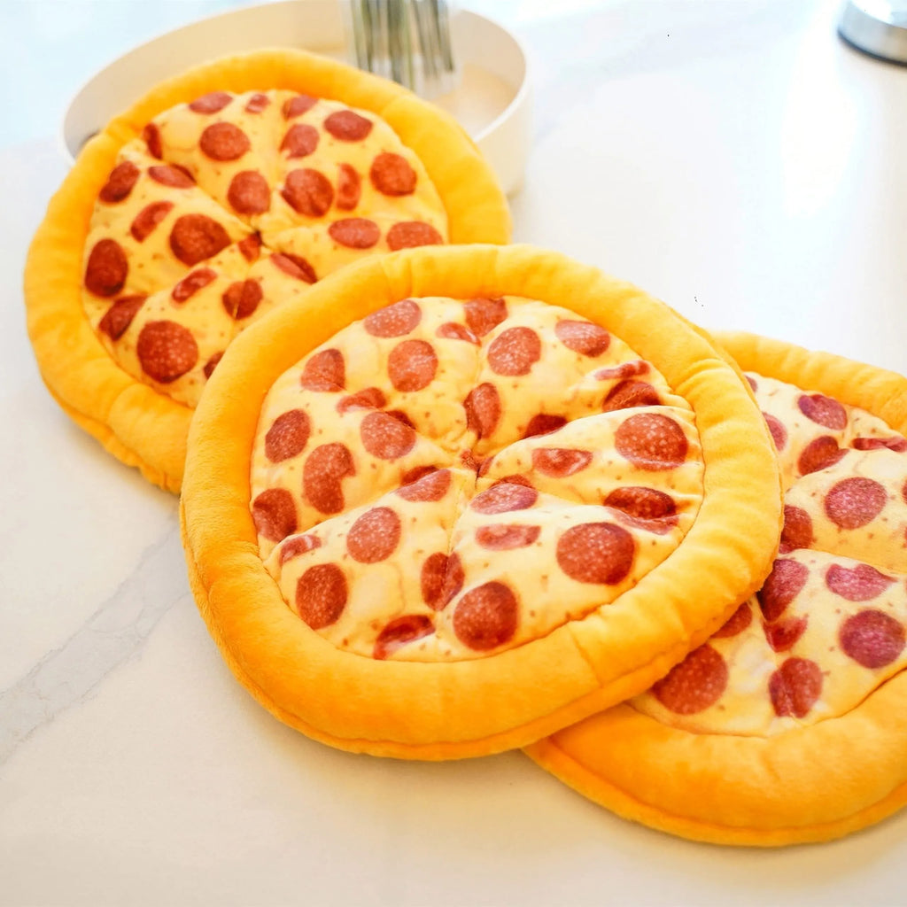 Yellow pizza slice dog chew toy with teddy bear design on top