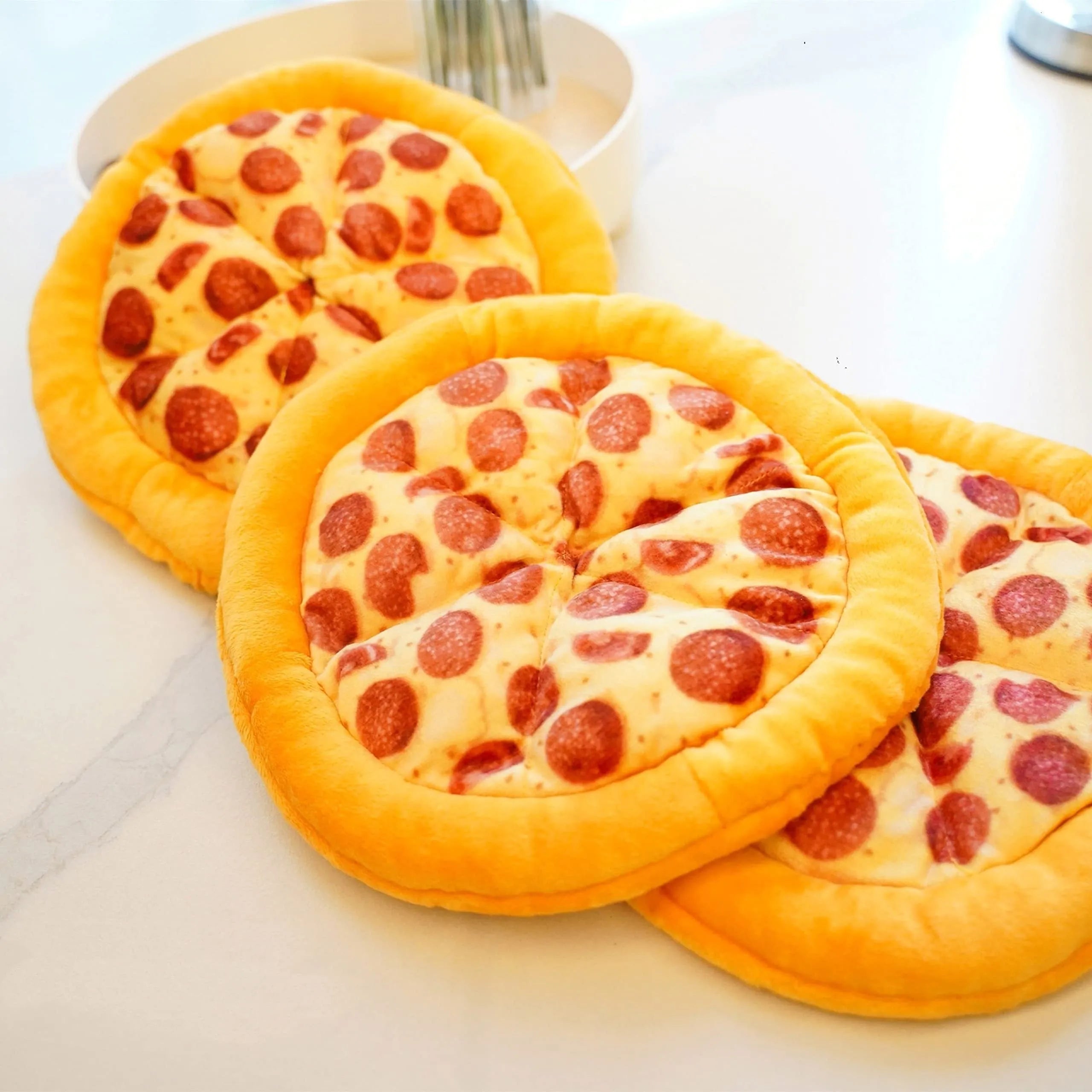 Yellow pizza slice dog chew toy with teddy bear design on top