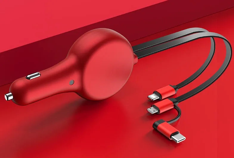 Black retractable dual-port car charger with extended cables next to smartphone