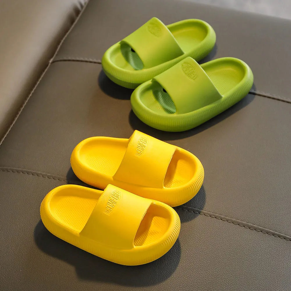 Children's EVA injection-moulded slippers with non-slip soles in mixed colours, shown in multiple sizes.