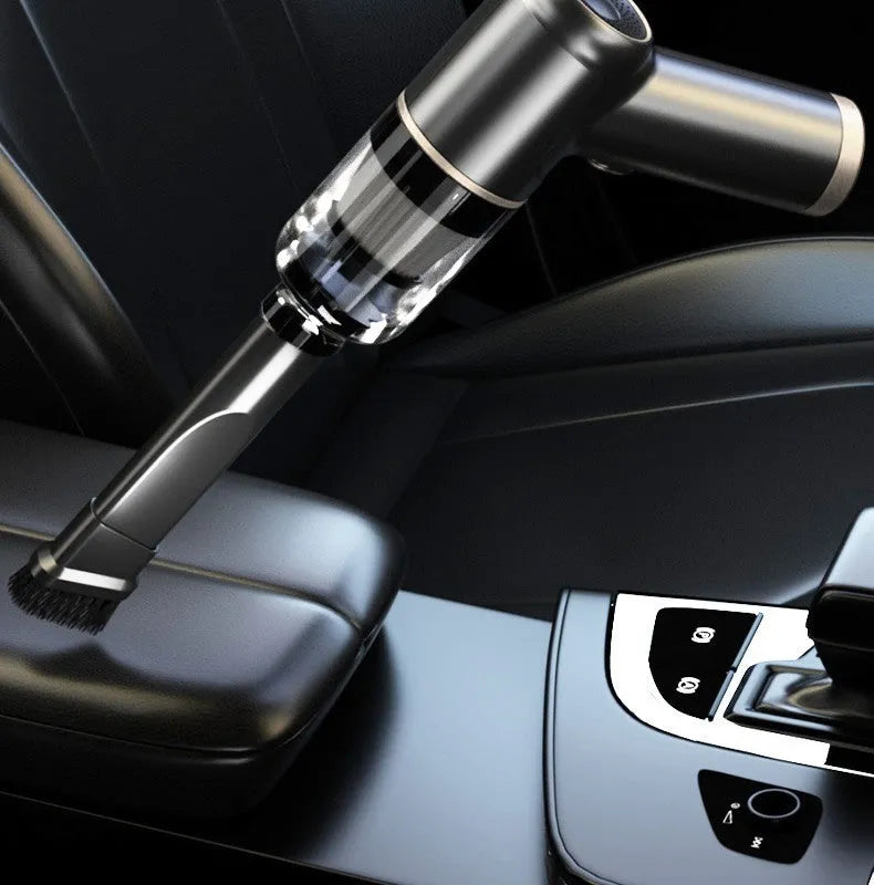Black wireless car and home vacuum cleaner with accessories including brush heads and nozzles