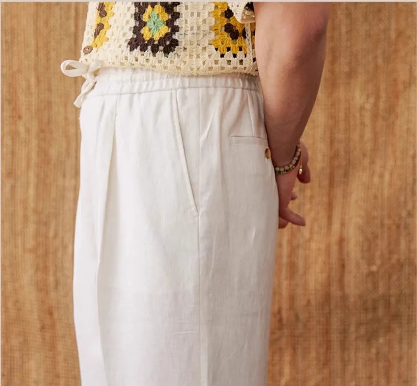 Women's high-waist linen trousers in greige colour with a straight-leg cut and elasticated waistband.