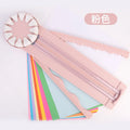 Pink and black 12-in-1 multifunctional plastic paper cutter with dotted guides on a cutting mat.