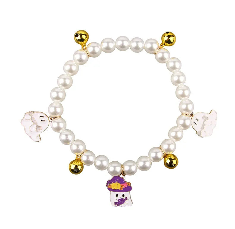 Halloween decorative pet collar with simulated pearl necklace and pumpkin designs in purple, black, and orange.
