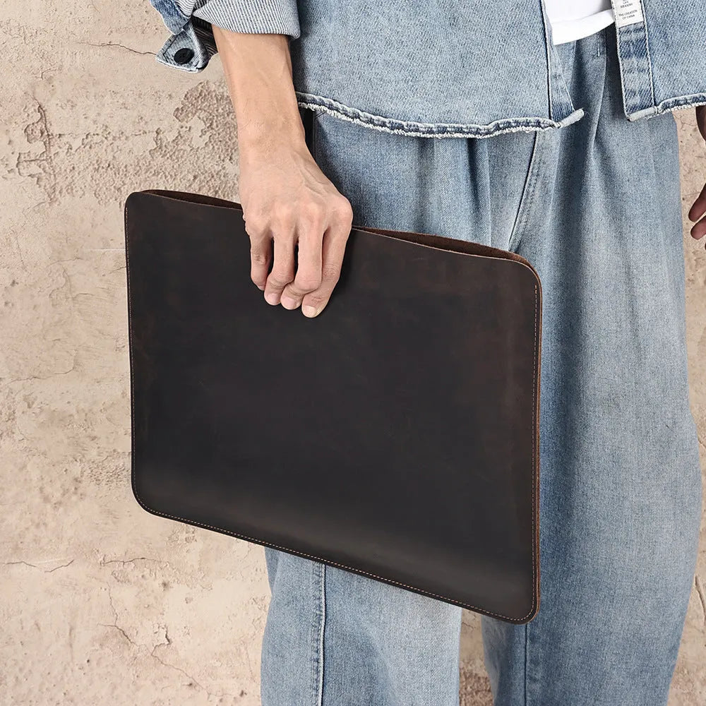 Brown genuine leather computer bag with horizontal liner design for organised storage