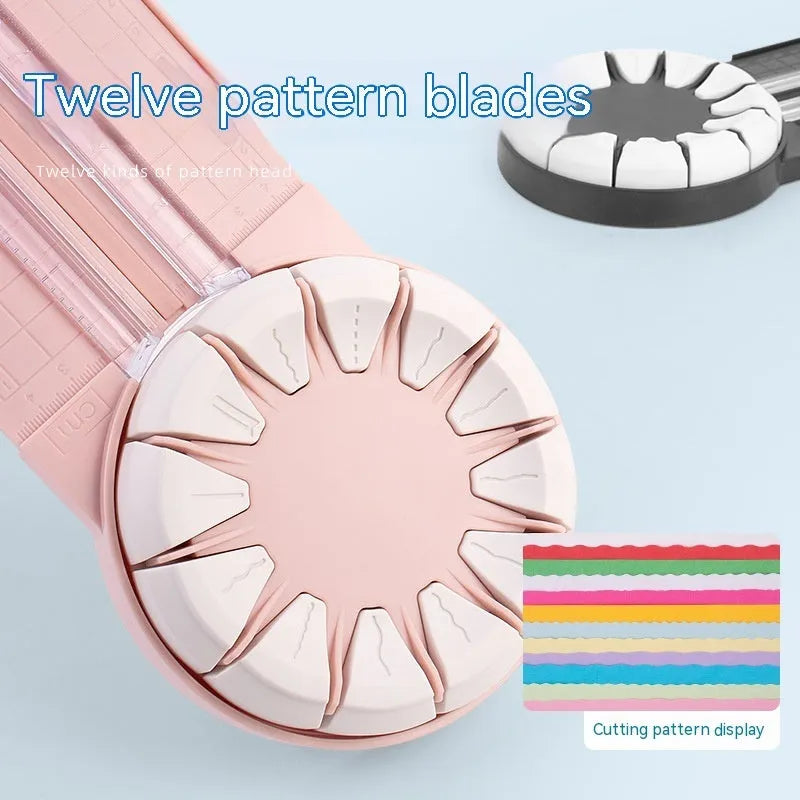 Pink and black 12-in-1 multifunctional plastic paper cutter with dotted guides on a cutting mat.