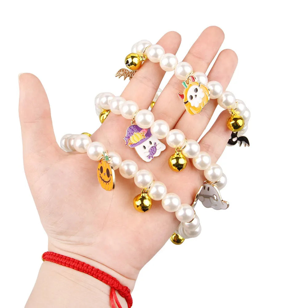 Halloween decorative pet collar with simulated pearl necklace and pumpkin designs in purple, black, and orange.