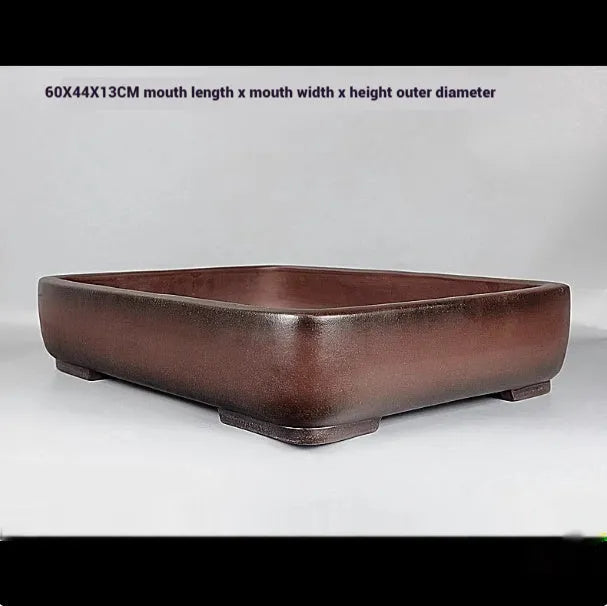 Handmade rectangular antique-style purple clay flower pot showing natural ceramic material