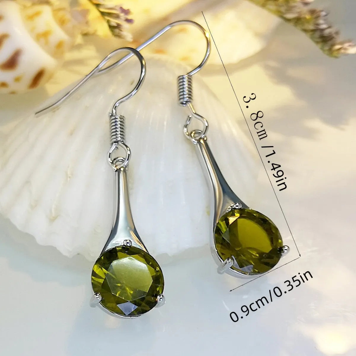 A pair of olive green retro-style drop earrings made from alloy on a white background.