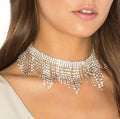 Alloy necklace with gold electroplated finish, geometric tassel pendant, diamond centre, box chain on white background