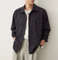 Men's light sand rice coloured long sleeve shirt with a simple lapel, laid flat.