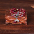 Natural watermelon crystal bracelet with Chinese knot fastening showing bi-colour gemstone beads
