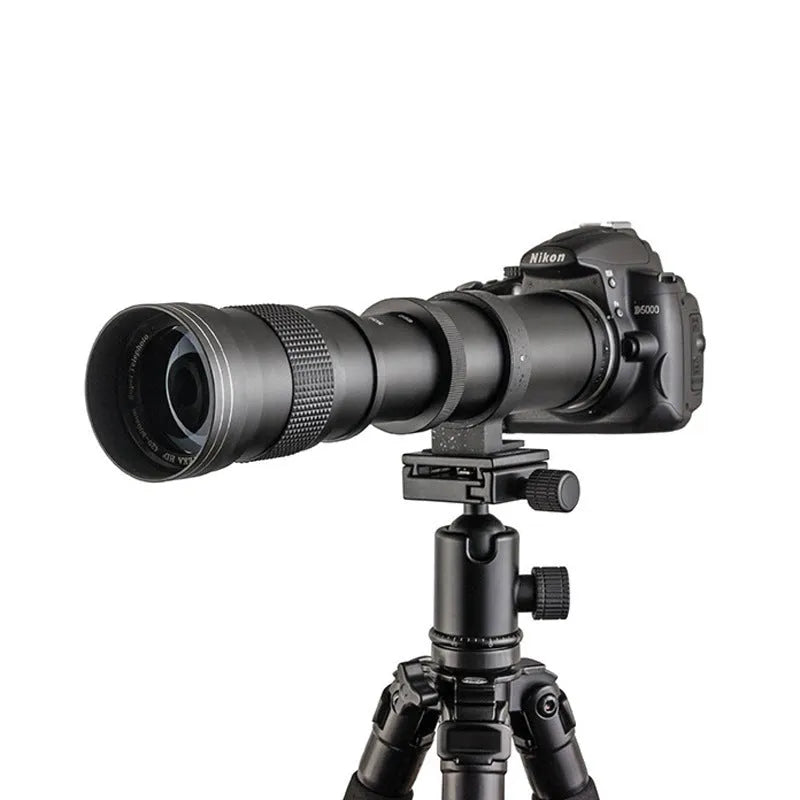 420-800mm manual telephoto zoom camera lens with T-mount adapter on a grey background.