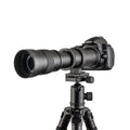 420-800mm manual telephoto zoom camera lens with T-mount adapter on a grey background.