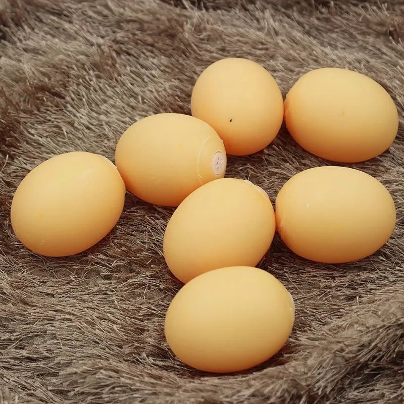 White simulation egg dog toy with textured surface for squeaking sound and tooth cleaning