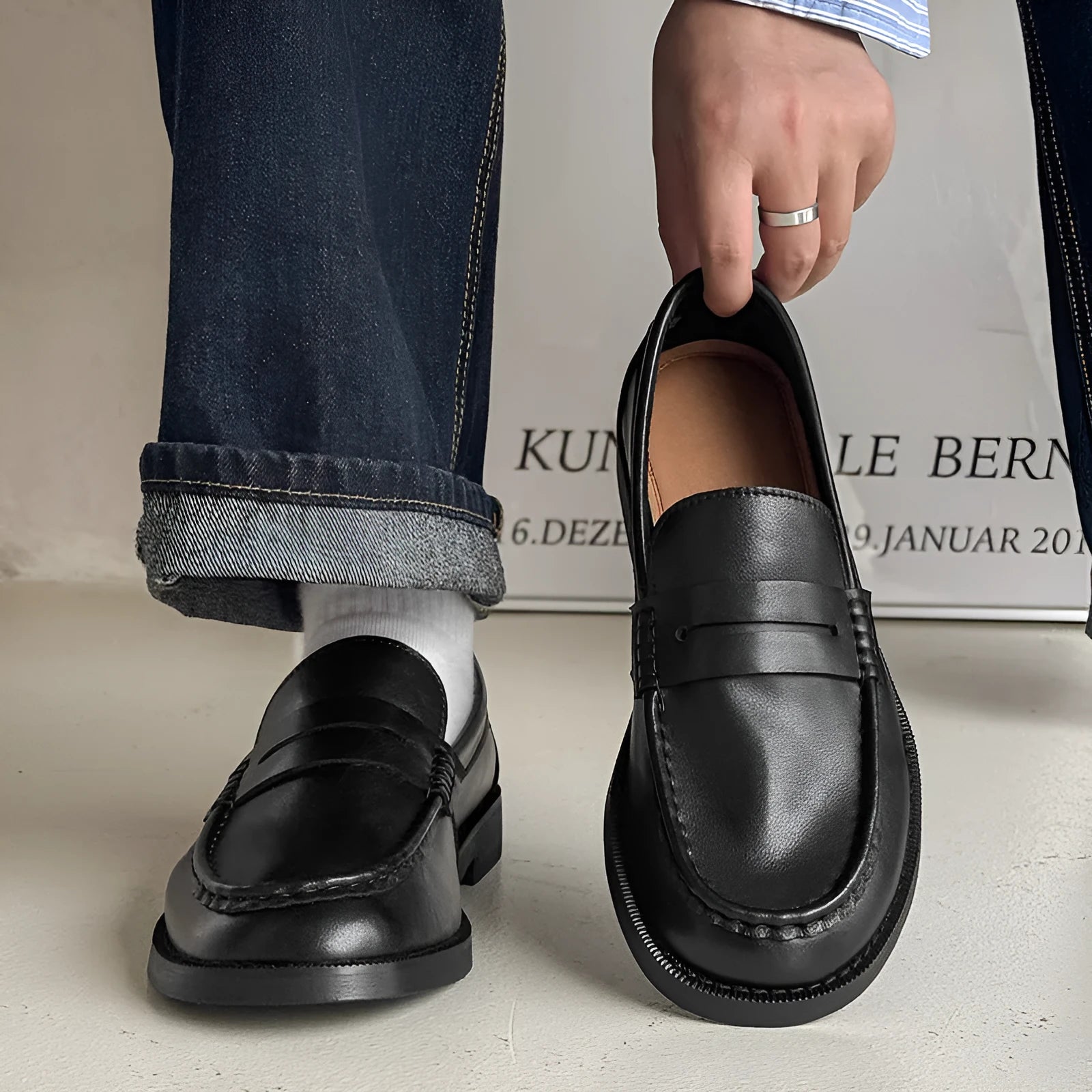 A pair of men's slip-on casual shoes in microfiber, shown in one of four colours: black, beige, apricot, or brown.