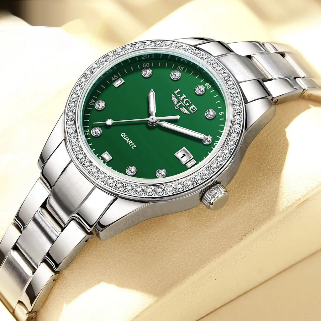 Silver stainless steel women's quartz watch with luminous hands on a 34mm round dial.