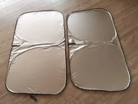 Titanium silver aluminium foil car sunshade unfolded, showing reflective surface.
