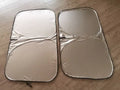 Titanium silver aluminium foil car sunshade unfolded, showing reflective surface.