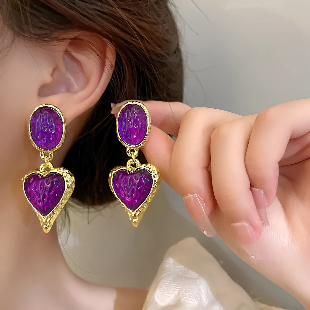 Silver needle pleated oval love heart alloy stud earrings in purple, red, green, and yellow and white colours.