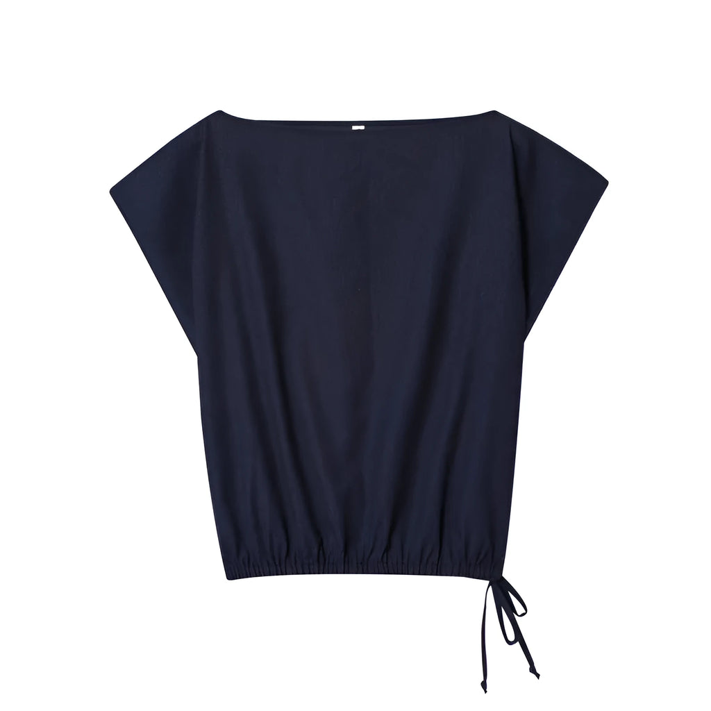 Women's off-neck linen-style shirt with flounced sleeves and matching wide-leg trousers, a two-piece set for office wear.