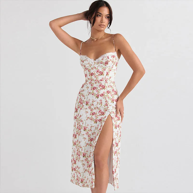 Blue lace flowers print long dress on a mannequin, showing side slit and suspender straps.
