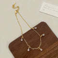 Zircon jewellery set with meteor shower geometric pendant necklace, matching earrings, and anklet