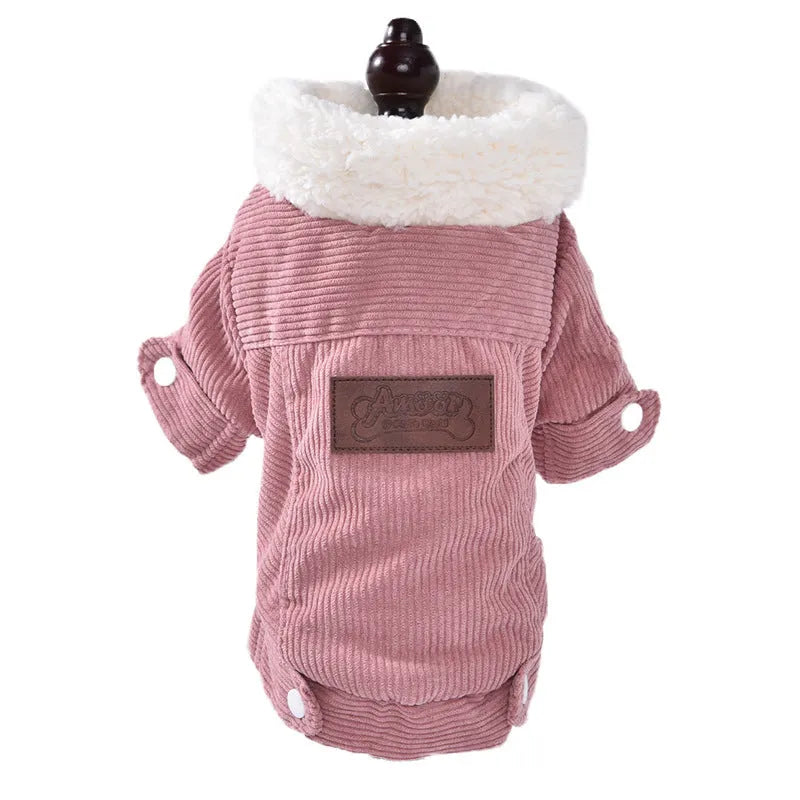 A grey lambswool fleece-lined vest for dogs on a hanger, showing its soft lining and size label.