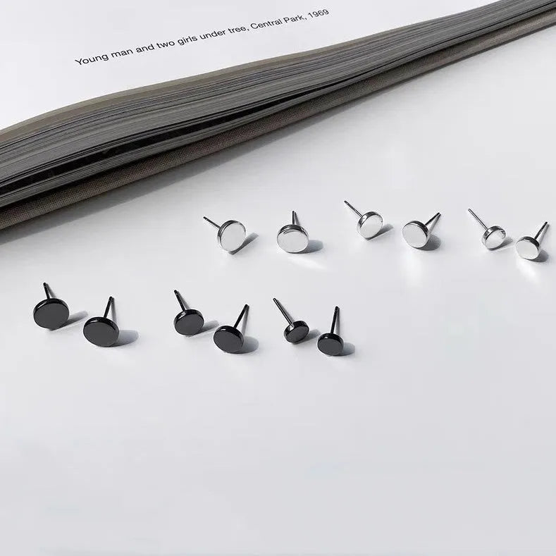 S999 sterling silver flat ear bone studs in round shape, showing silver and black colour options.